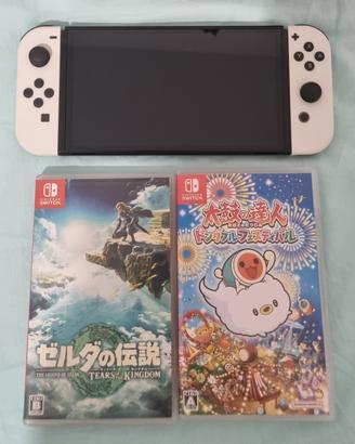 nintendo switch oled + due giochi + cover rigida