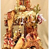 Presepe circolare su base di legno lavorato