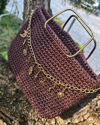 borsa con ciondoli oro