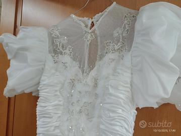 Abito sposa fatto a mano in atelier, velo e guanti