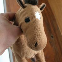 Peluche Cavallo marrone con stella