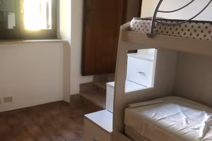 STANZA CON BAGNO PRIVATO E CUCINA CONDIVISA