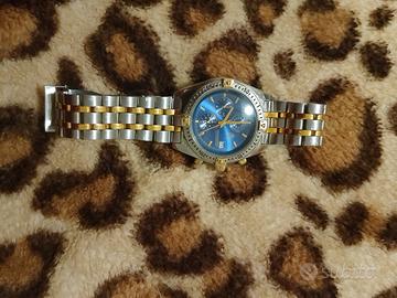 orologio color argento e oro