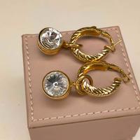 ORECCHINI A CERCHIO DORATI CON MAXI PENDENTE