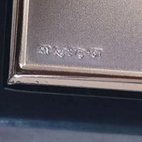 Grande cornice con specchio in lamina di argento