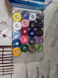 Macchina da cucire portatile + bobine colorate
