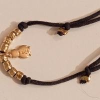 Dodo Gufetto e 8 granelli il tutto oro 18 kt