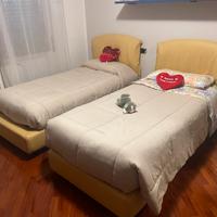 Letto singolo rivestito in pelle e rete a doghe