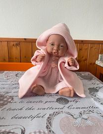 bambola che sembra vera