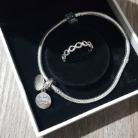 Bracciale Moments con charm ed anello
