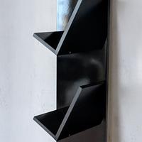 Libreria da muro di design nero lucido