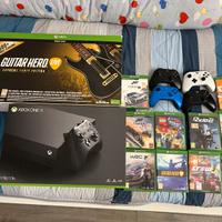 XBOX ONE X + GIOCHI + CHITARRE + VOLANTE + CUFFIE