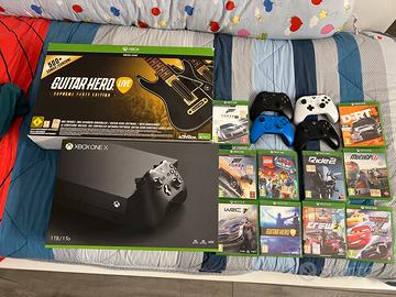 XBOX ONE X + GIOCHI + CHITARRE + VOLANTE + CUFFIE
