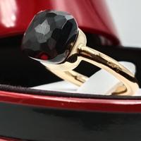 Anello Nudo Pomellato in oro rosa e Granato