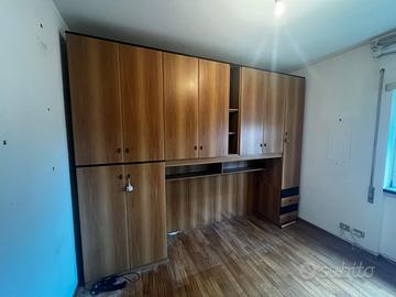 Libreria e scrittorio integrato e armadio a ponte