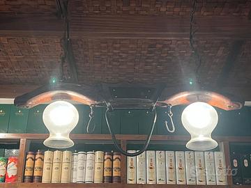 Lampadari artigianali ricavati da antichi gioghi