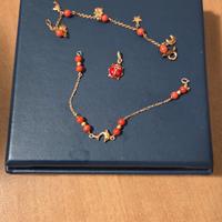 Braccialetti neonato oro + coralli e ciondolo