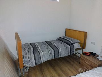 Letto con sollevatore elettrico