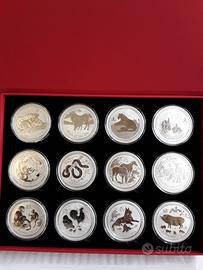 12 Monete da 2 once Ag lunar II + coffaneto plasti