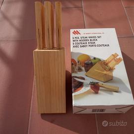 Ceppo in legno e coltelli