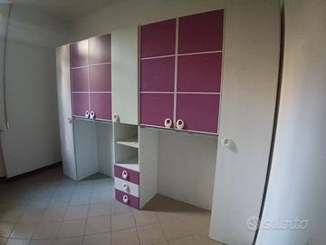 Cameretta con armadio a ponte e letto singolo