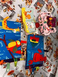 Set 4 libri in tessuto "rumorosi" per neonati