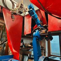 Robot con isola di saldatura