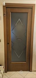porta in legno  a scrigno vetrata 