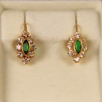 Orecchini in oro giallo 750 con smeraldi.