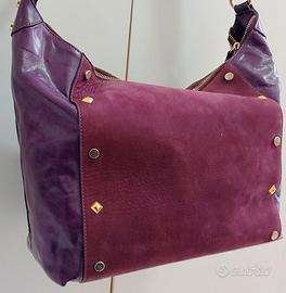 Borsa da donna vera pelle colore viola firmata.