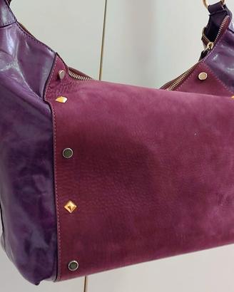 Borsa da donna vera pelle colore viola firmata.