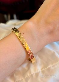 Bracciale monogramma da donna in metallo color oro