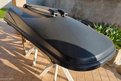 Box tetto auto  e barre portapacchi.