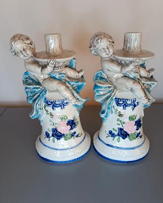 Coppia candelieri vintage in ceramica con putti