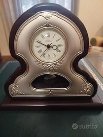 Orologio a pendolo argento e legno