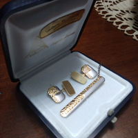 Parure fermacravatta e gemelli oro e argento