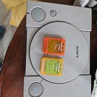 PS1 con joystick e memory card