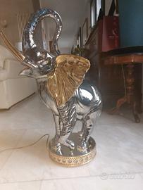 elefante bagnato in oro argento