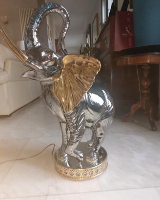 elefante bagnato in oro argento