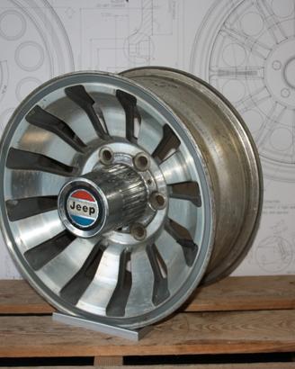 JEEP WAGONEER CERCHI ORIGINALI 7x15 con coppe