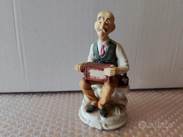 Statuina Capodimonte vecchio con clarinetto