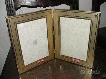 Cornice doppia in alluminio dorato con decori