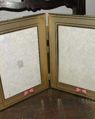 Cornice doppia in alluminio dorato con decori