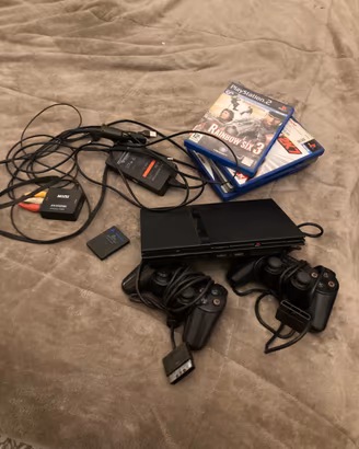 Playstation 2 + controller (2) +adattatore+ giochi