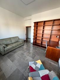 Camera studio con divano letto