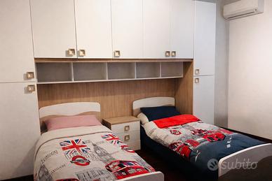 Cameretta con armadio a ponte e due letti singoli