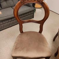 Tavolo in legno ovale intarsiato con sedie