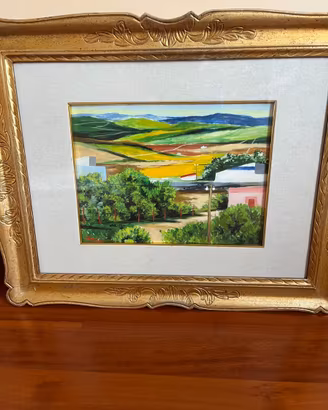 Quadro paesaggistico con cornice dorata