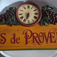 Insegna con orologio da parete