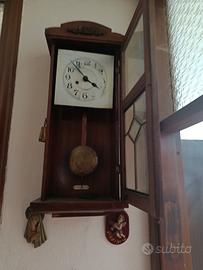 Orologio a pendolo da parete vintage
